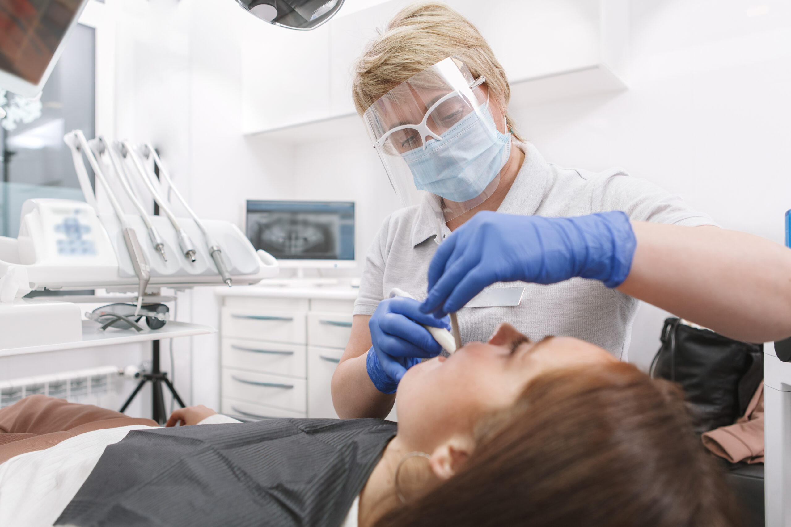Young Woman Getting Dental Treatment