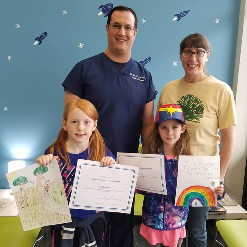 Dr. Ryan Francois with community members