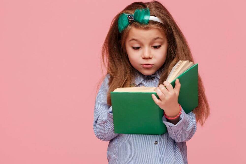 Girl is excited to read green book