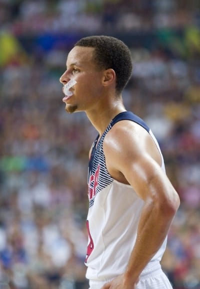 Steph Curry wears a mouth guard