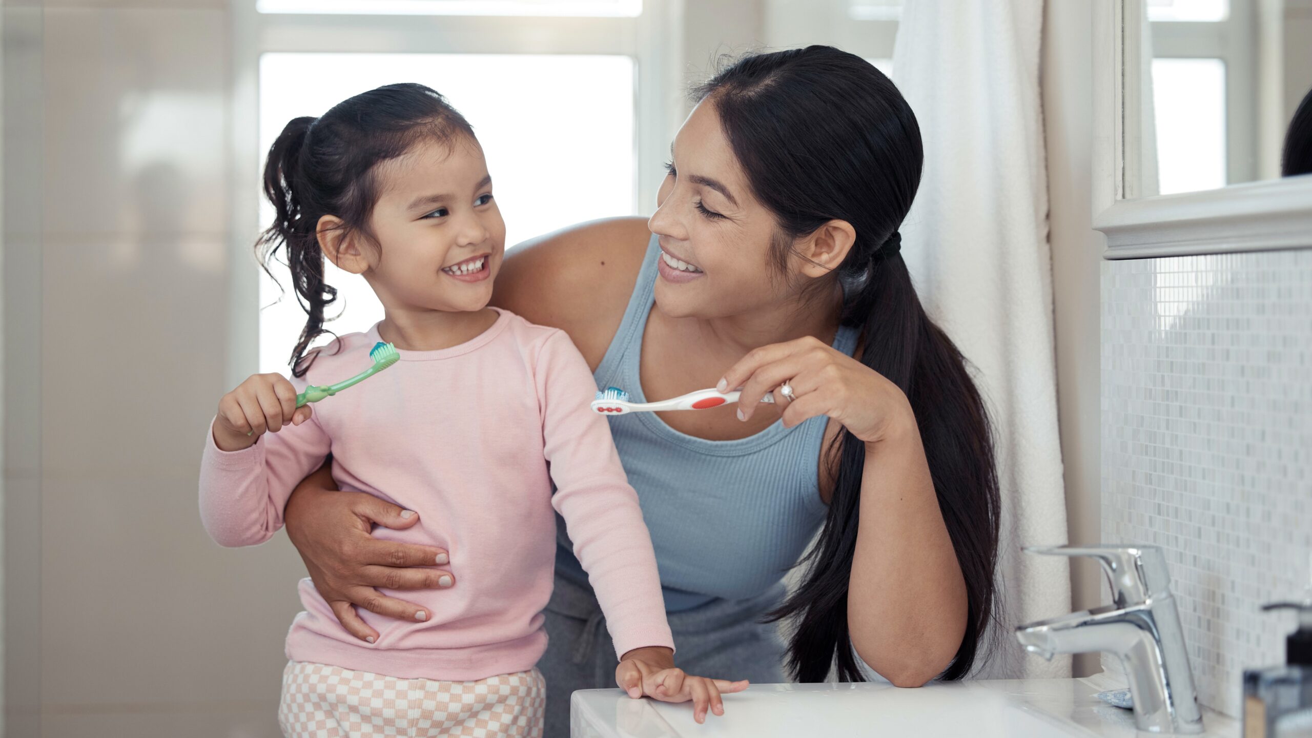 Mom And Child Brush Teeth Together