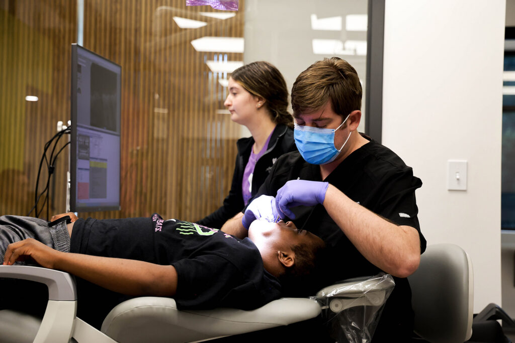 Dr. Dallin Roberts performs a pediatric dental checkup